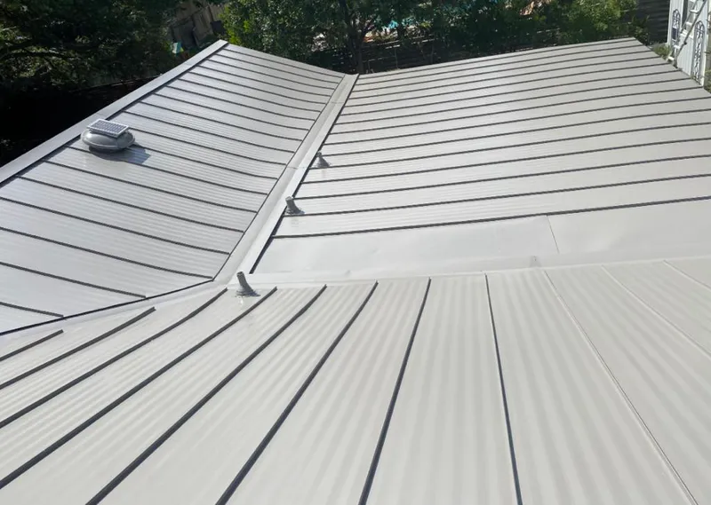Solar attic fan installed on a metal roof for Roof Ventilation in Miramar Beach